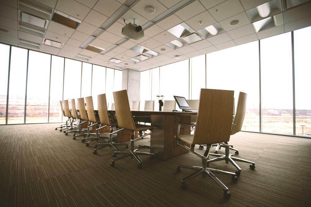 Modern boardroom prepared for a programme review